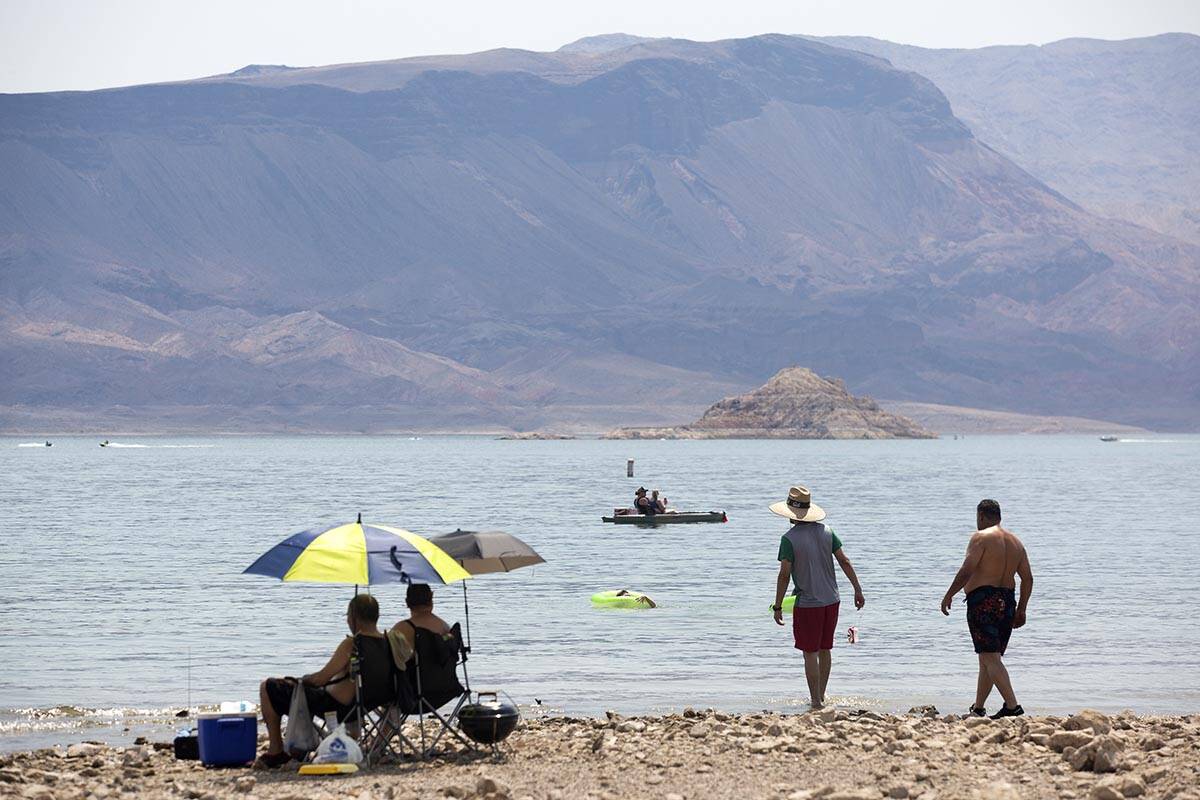 People sun themselves, jet ski, kayak and swim along Boulder Beach at Lake Mead on Saturday, Ju ...