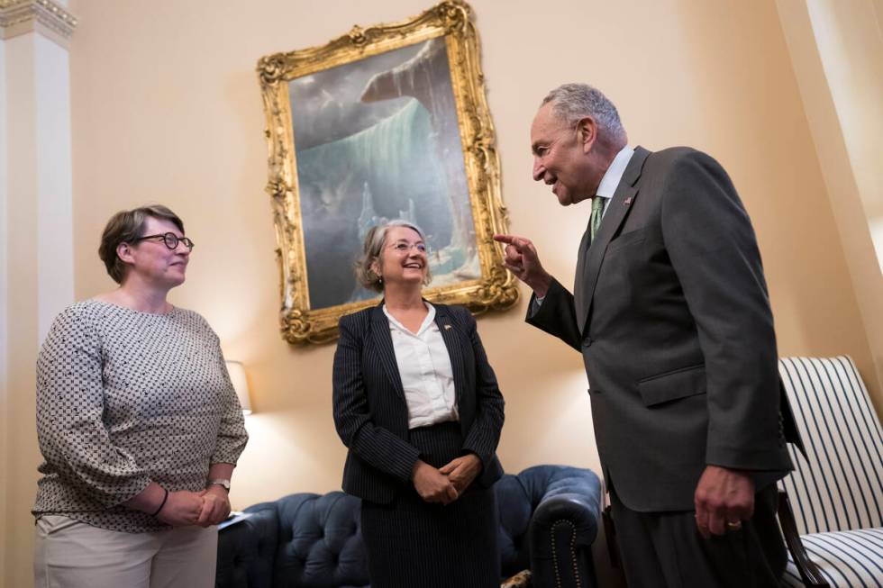 Senate Majority Leader Chuck Schumer, D-N.Y., right, welcomes Paivi Nevala, minister counselor ...
