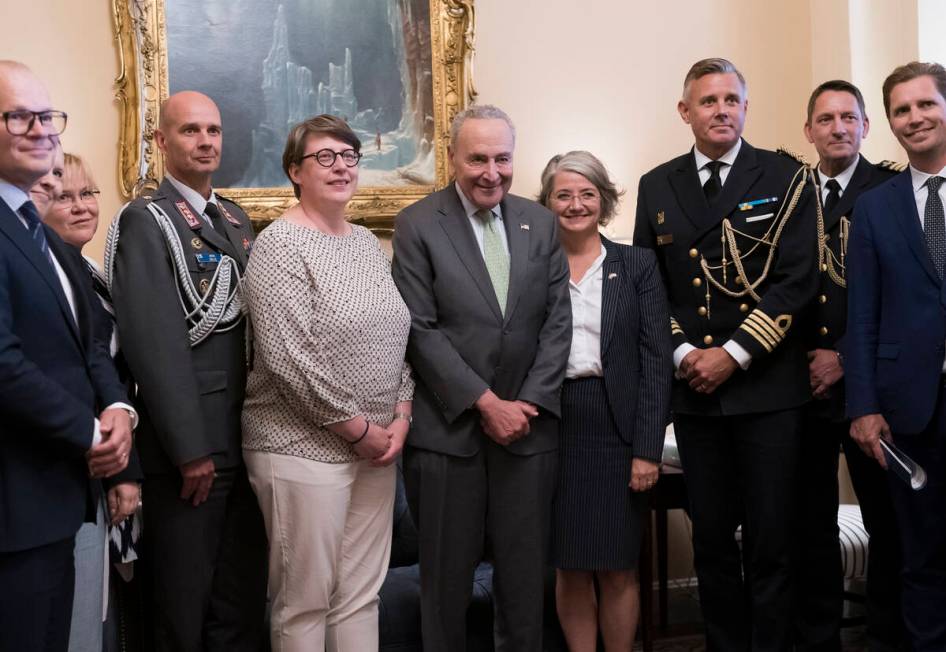 Senate Majority Leader Chuck Schumer, D-N.Y., center, is flanked by Paivi Nevala, minister coun ...