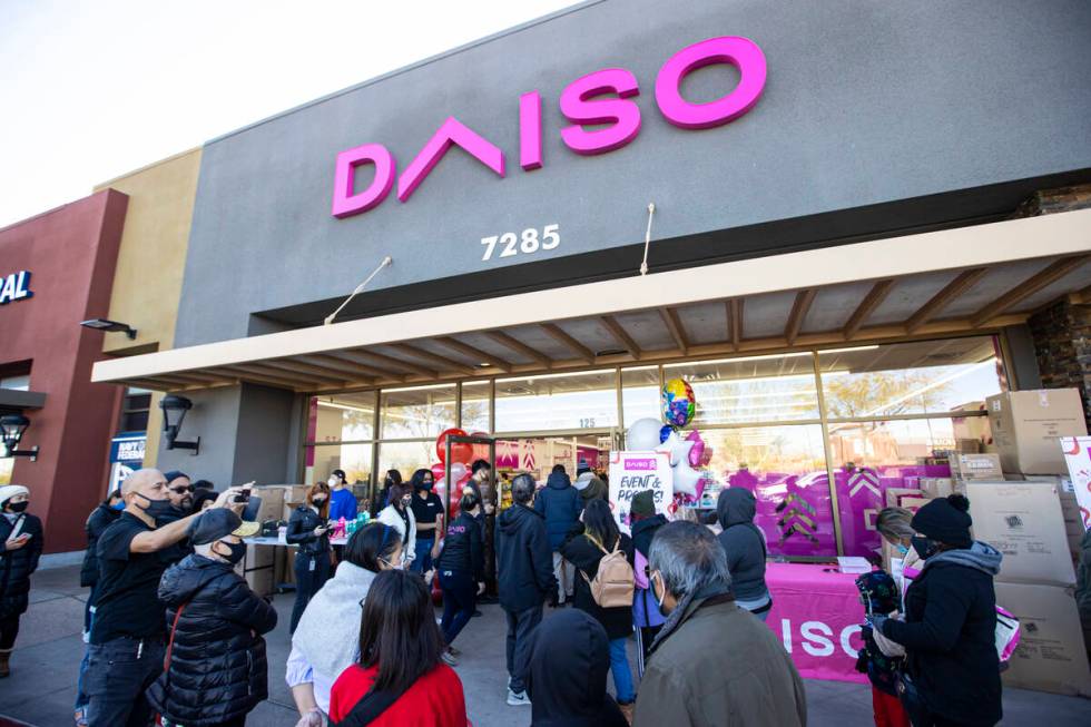 Customers enter Daiso, a popular Japanese discount store, during the grand opening of its first ...