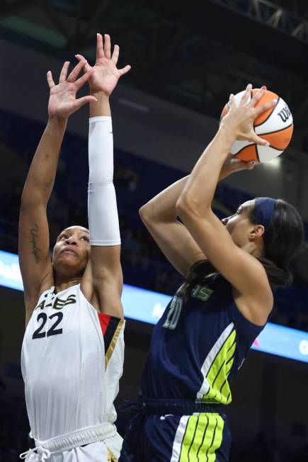 Las Vegas Aces forward A'ja Wilson (22) defends against Dallas Wings forward Isabelle Harrison ...