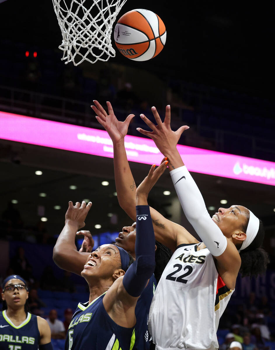 Dallas Wings center Teaira McCowan, Dallas Wings forward Kayla Thornton and Las Vegas Aces forw ...