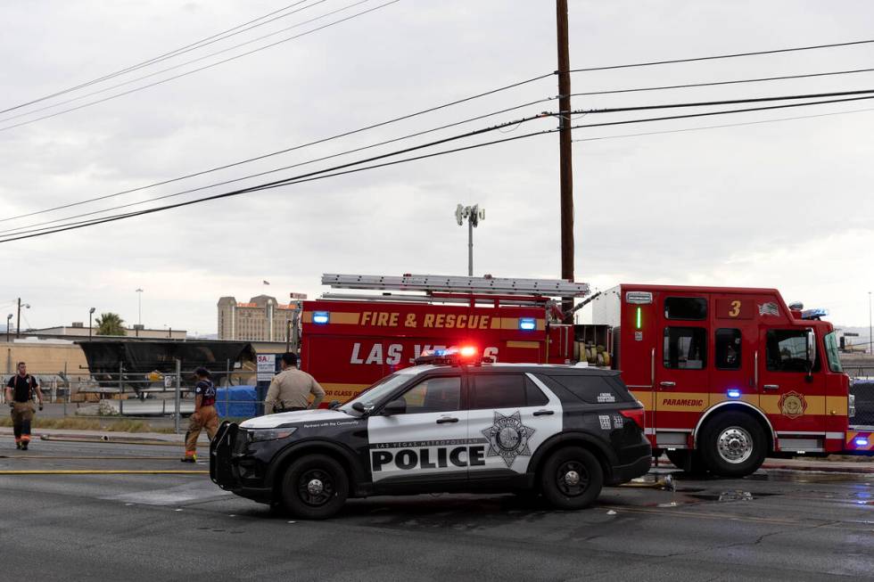 Metropolitan police respond while Las Vegas fire crews put out a fire at 2330 Industrial Road o ...