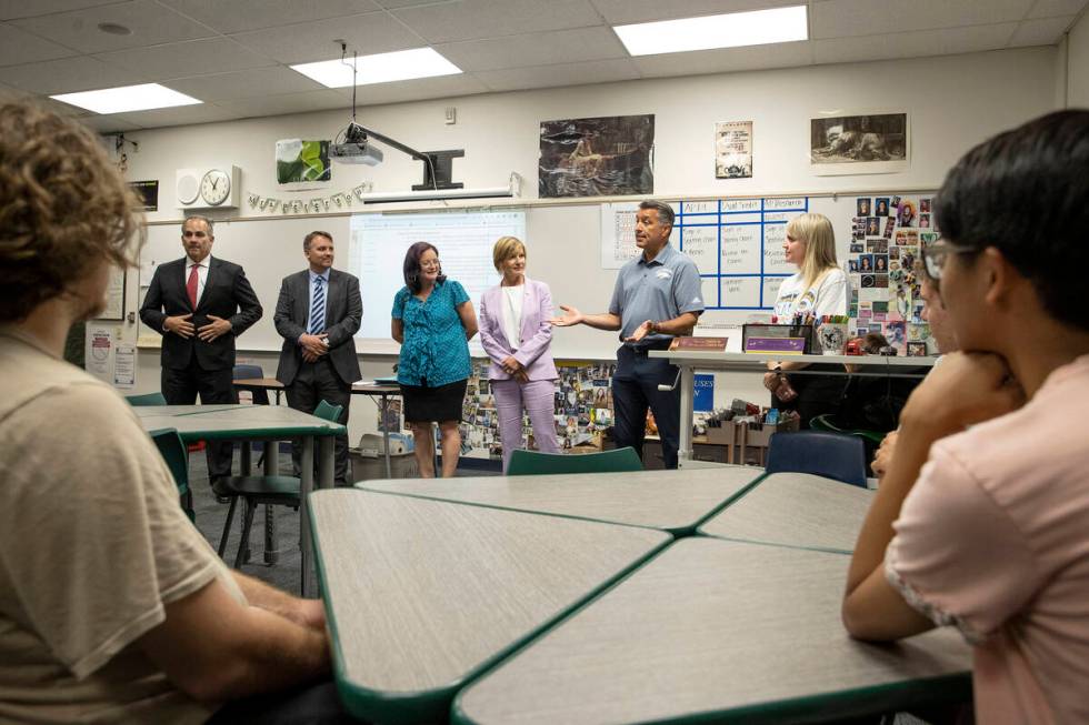 University of Nevada-Reno President Brian Sandoval, second from right, speaks to a class of stu ...