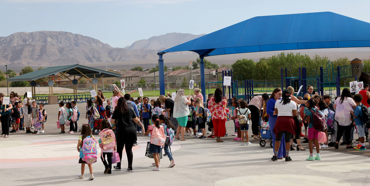 Students arrive for the first day of the school year at Hayden Elementary School in Las Vegas o ...