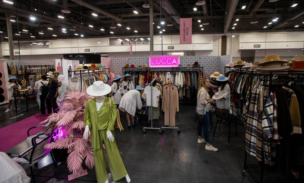People explore the Lucca booth during the MAGIC Las Vegas fashion trade show on Monday, Aug. 8, ...