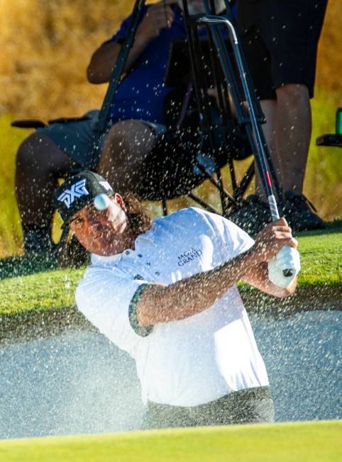 In this Oct. 6, 2019, file photo, Pat Perez blasts from the bunker and onto the green at hole 1 ...