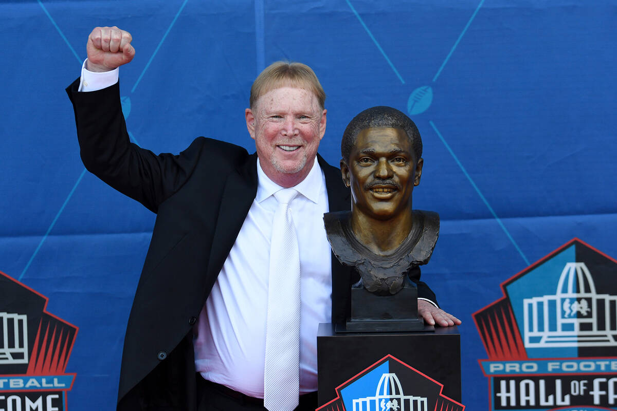 Mark Davis poses with a bust of former NFL player Cliff Branch during an induction ceremony at ...