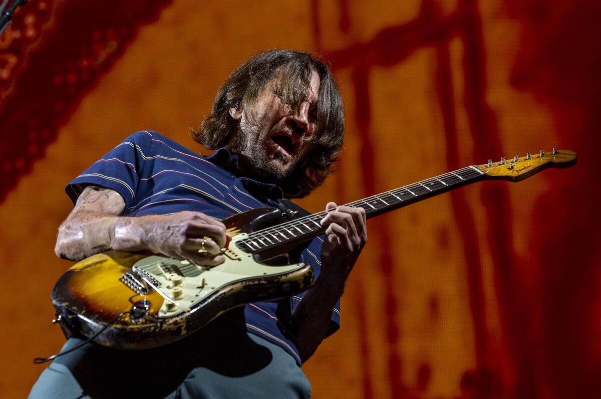 Lead guitar John Frusciante plays with The Red Hot Chili Peppers at Allegiant Stadium on Saturd ...