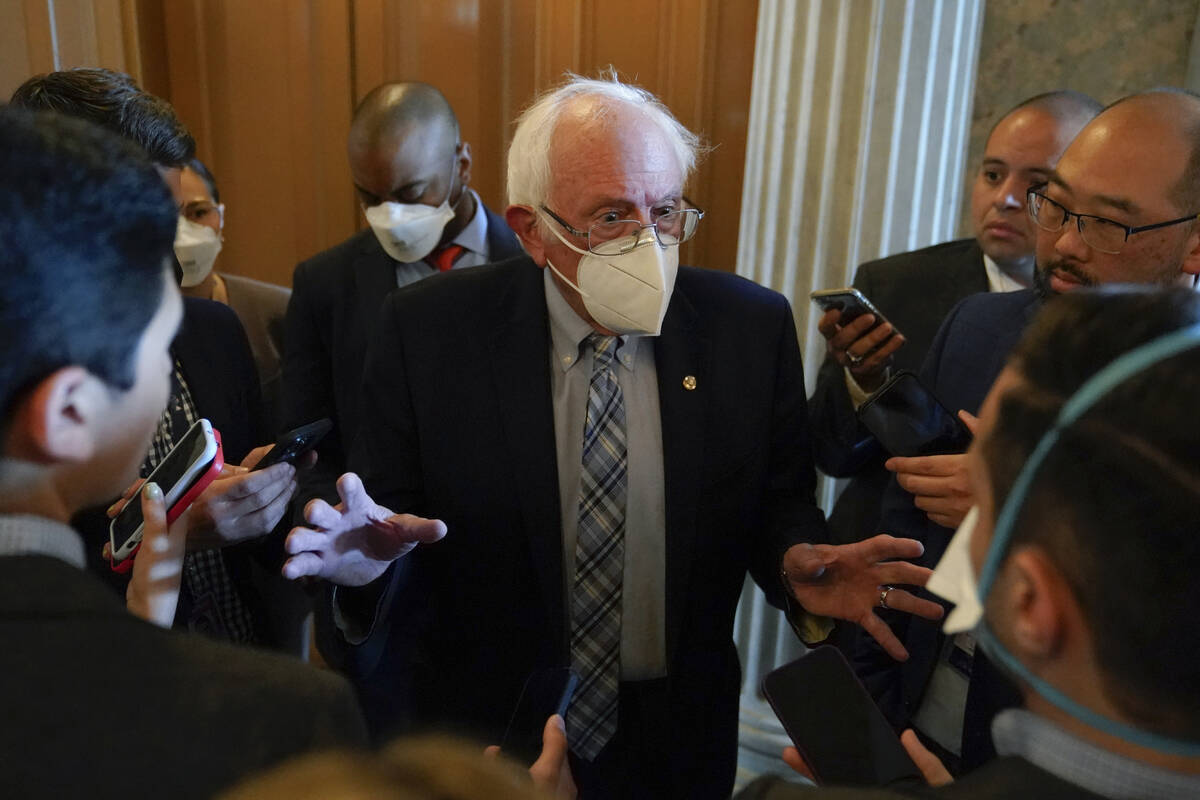 Sen. Bernie Sanders, I-Vt., speaks with reporters on Capitol Hill in Washington, Saturday, Aug. ...