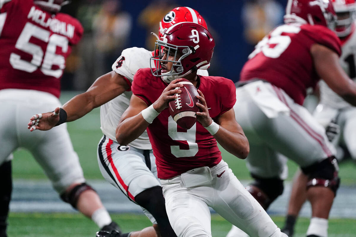 Alabama quarterback Bryce Young (9) works against Georgia during the second half of the Southea ...