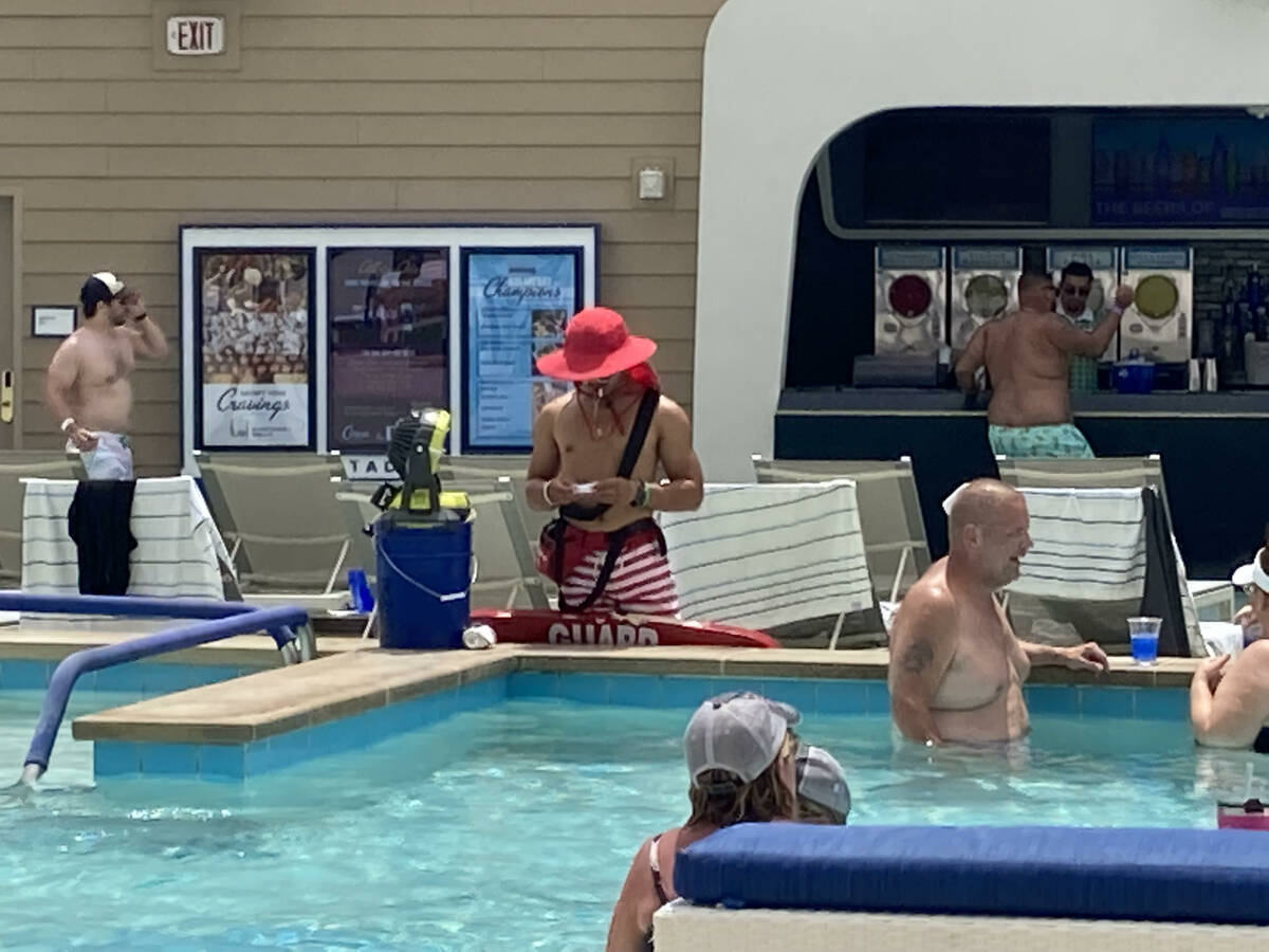 A lifeguard stands watching pool-goers at Circa Resort's Stadium Swim on July 22, 2022. Lifegua ...