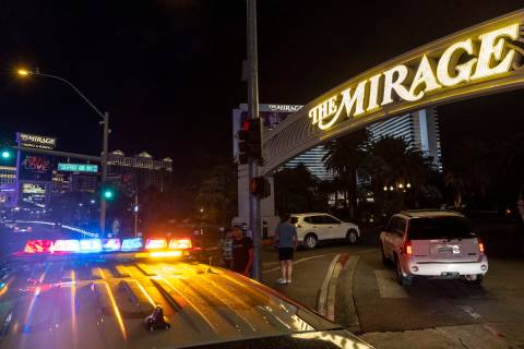 Cars begin to enter The Mirage after Las Vegas police blocked off the area due to a fatal shoot ...