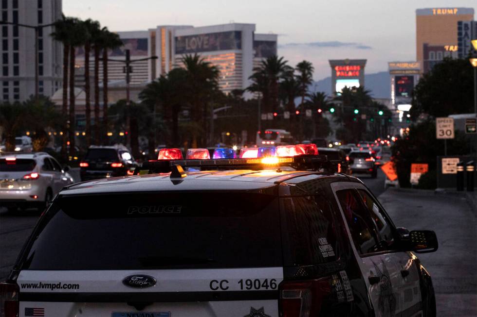 Metropolitan police patrol the Las Vegas Strip outside of Planet Hollywood on Tuesday, Aug. 2, ...