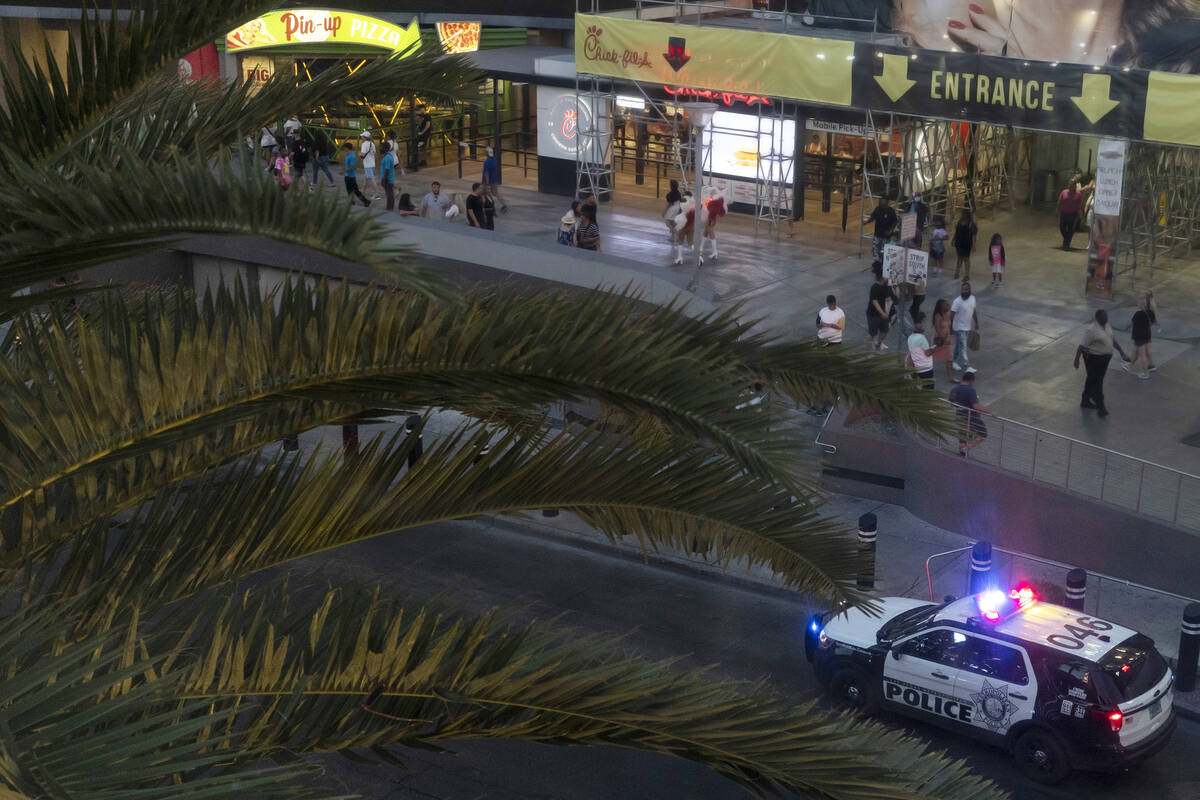 A Metropolitan police car patrols the Las Vegas Strip outside Planet Hollywood on Tuesday, Aug. ...