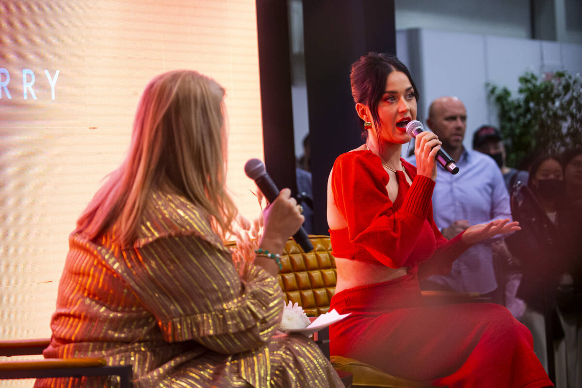 Katy Perry, right, talks with moderator Booth Moore during the MAGIC Las Vegas fashion trade sh ...