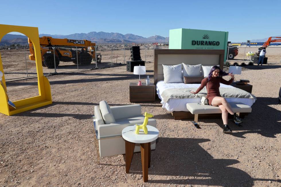 Greta Sereni poses with a set up a hotel room during a media event at the construction site for ...