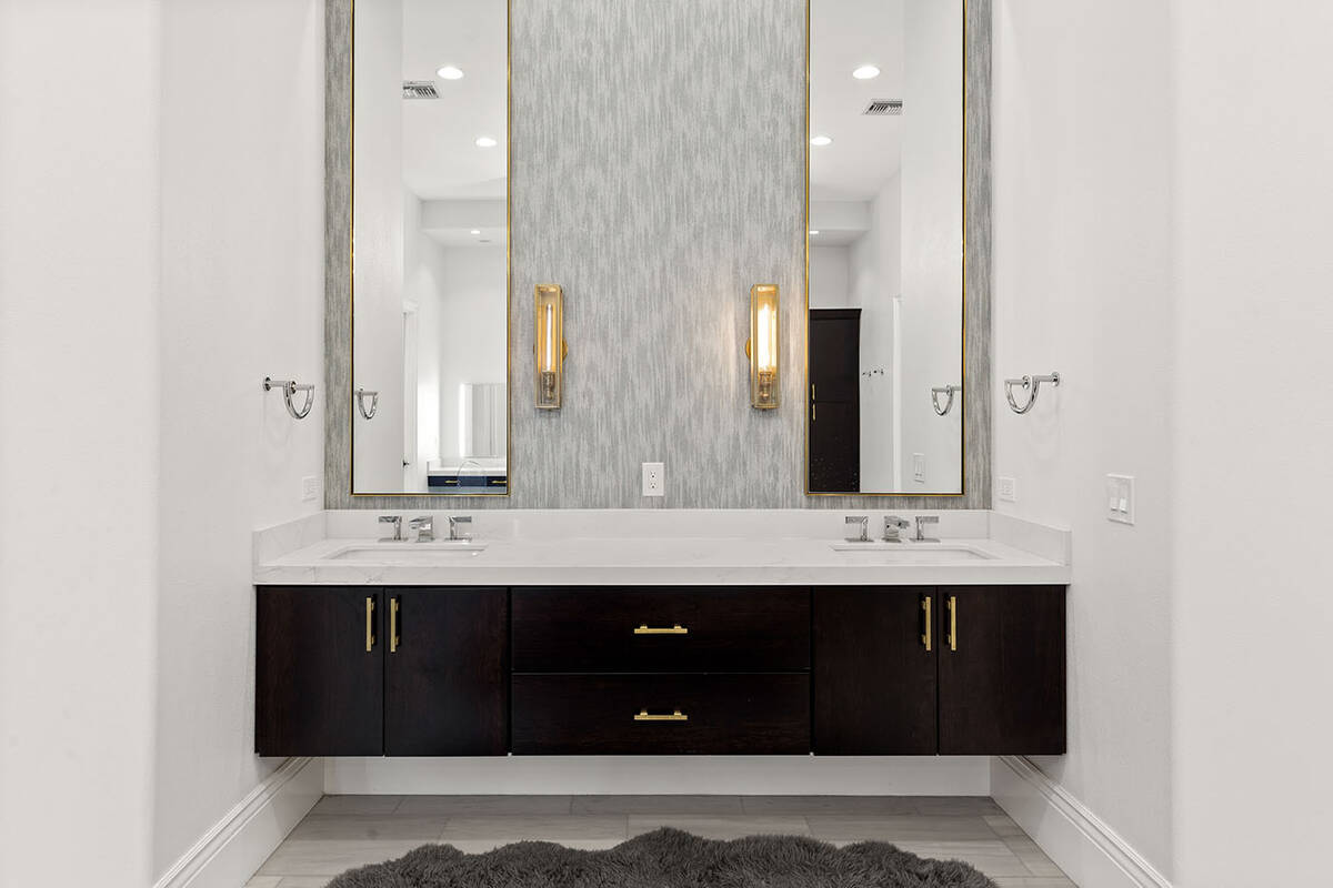 The primary bath features dual floating vanities. (Ivan Sher Group)