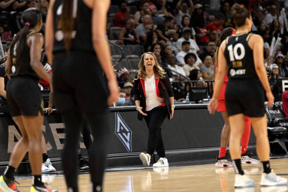 Las Vegas Aces head coach Becky Hammon cheers for her team during the first half of a WNBA bask ...
