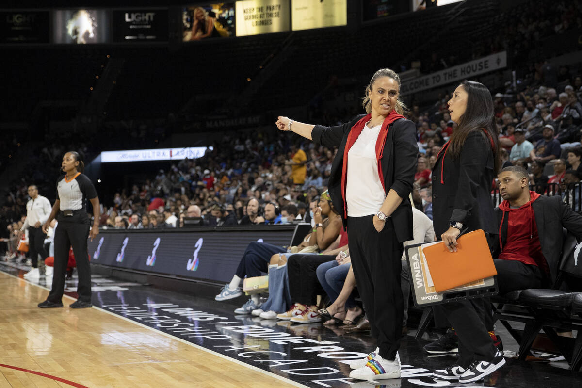 Las Vegas Aces head coach Becky Hammon and assistant coach Natalie Nakase communicate on the si ...