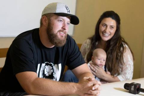 Raiders long snapper Trent Sieg, left, his wife Carly Sieg, right, and their three-month-old so ...