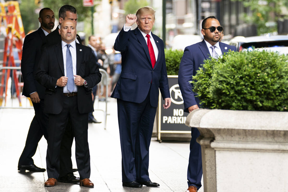 Former President Donald Trump gestures as he departs Trump Tower, Wednesday, Aug. 10, 2022, in ...