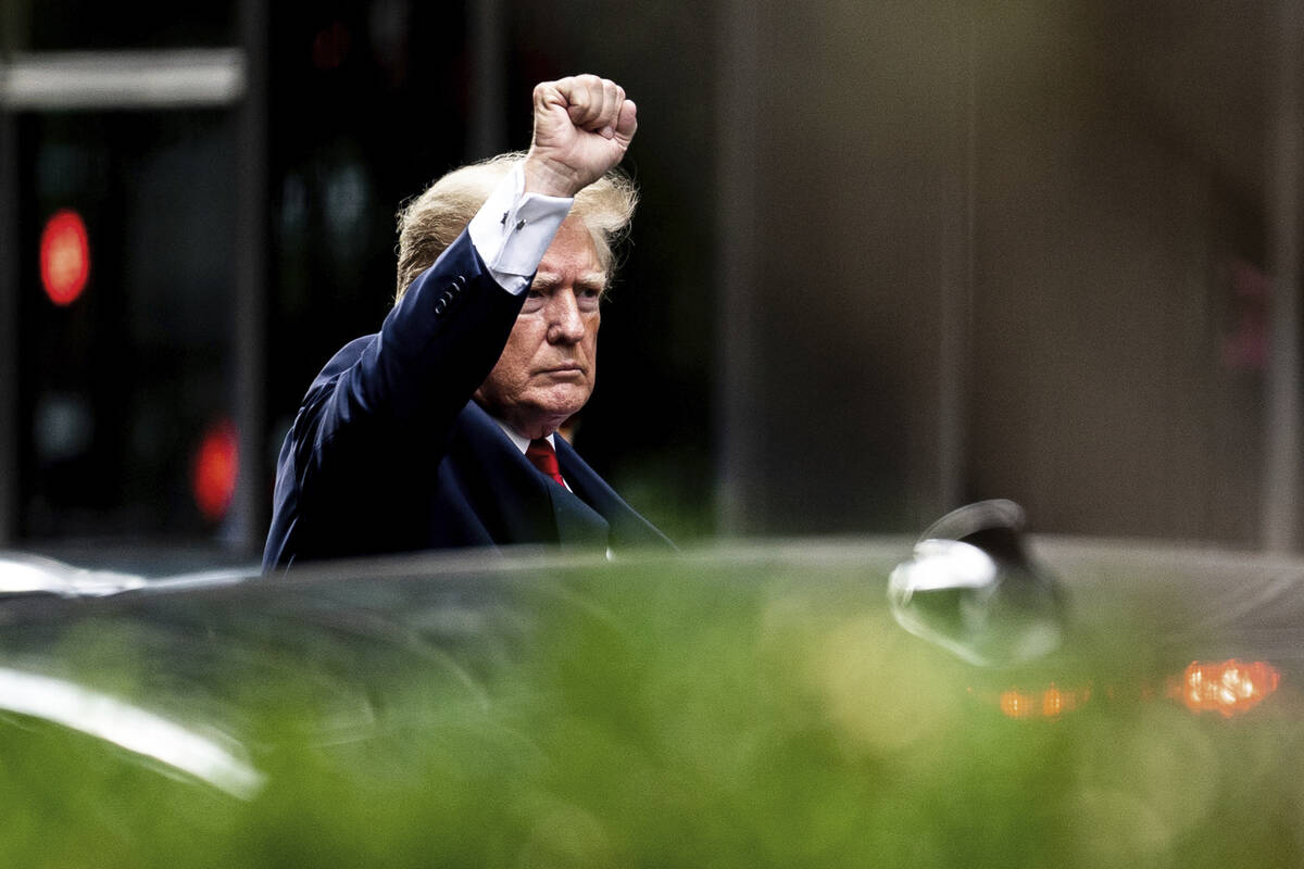 Former President Donald Trump gestures as he departs Trump Tower, Wednesday, Aug. 10, 2022, in ...
