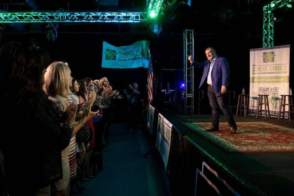 Sen. Ted Cruz, R-Texas, waves to the audience as a forum about school choice, hosted by politic ...