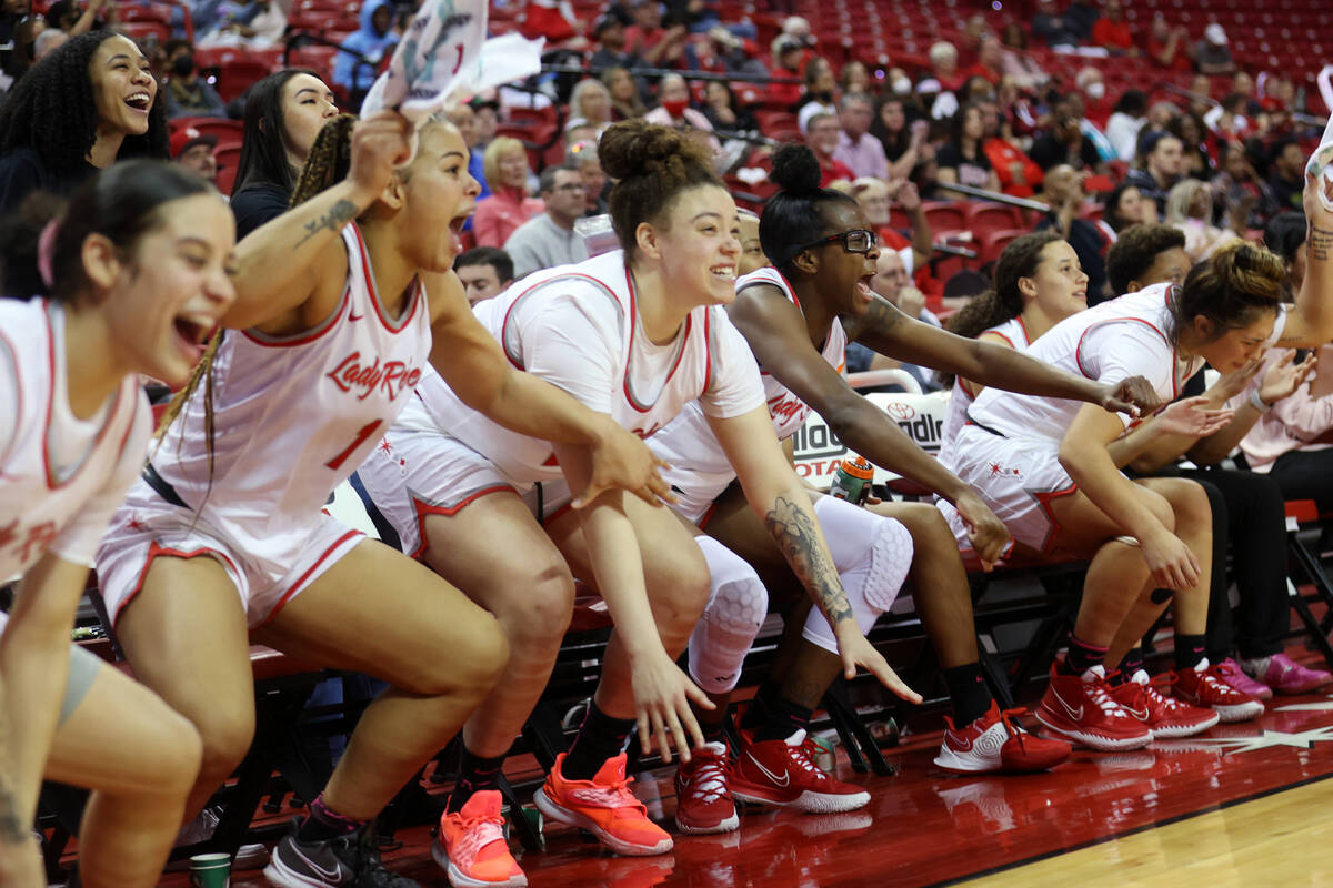 The UNLV Lady Rebels bench reacts after a play seconds before the end of their game against th ...