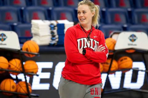 UNLV coach Lindy La Rocque smiles while watching the team shoot layups during practice for the ...