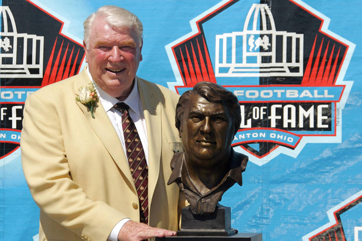 Broadcaster and former Oakland Raiders coach John Madden poses with his bust after enshrinement ...