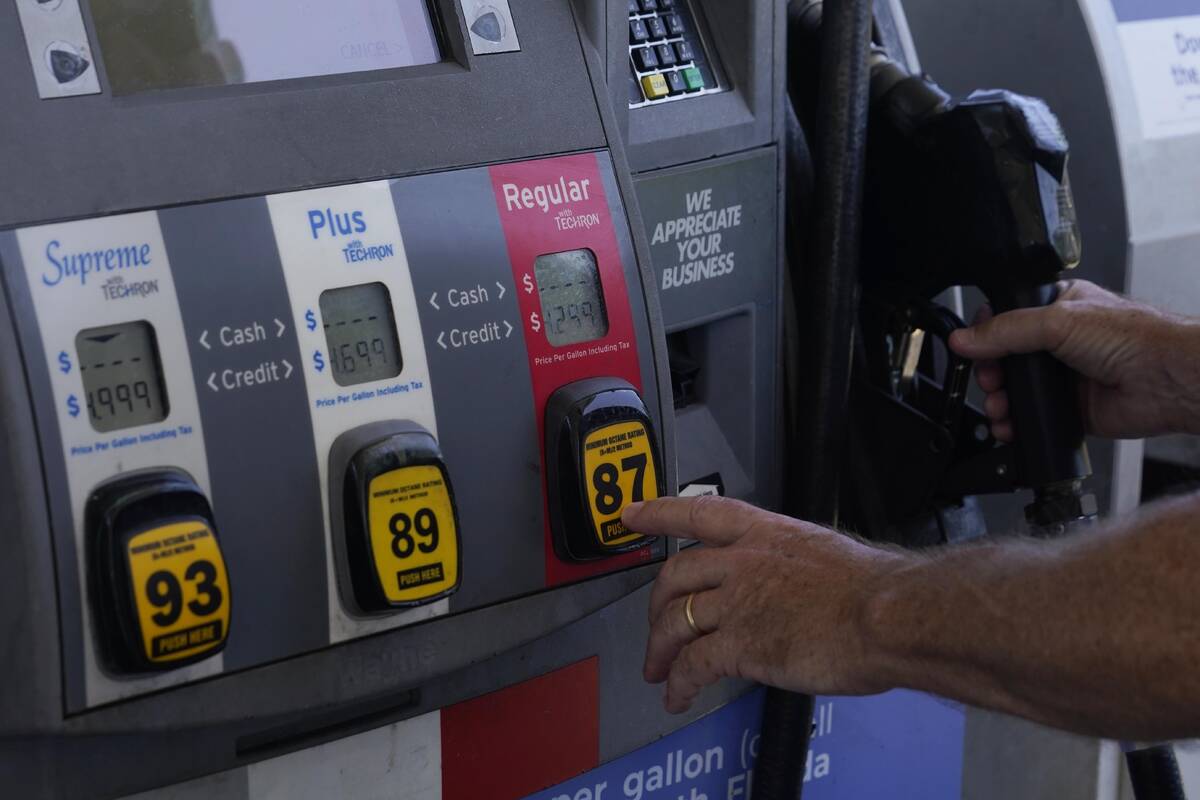 A customer pumps gas at an Exxon gas station, Tuesday, May 10, 2022, in Miami. Gasoline prices ...