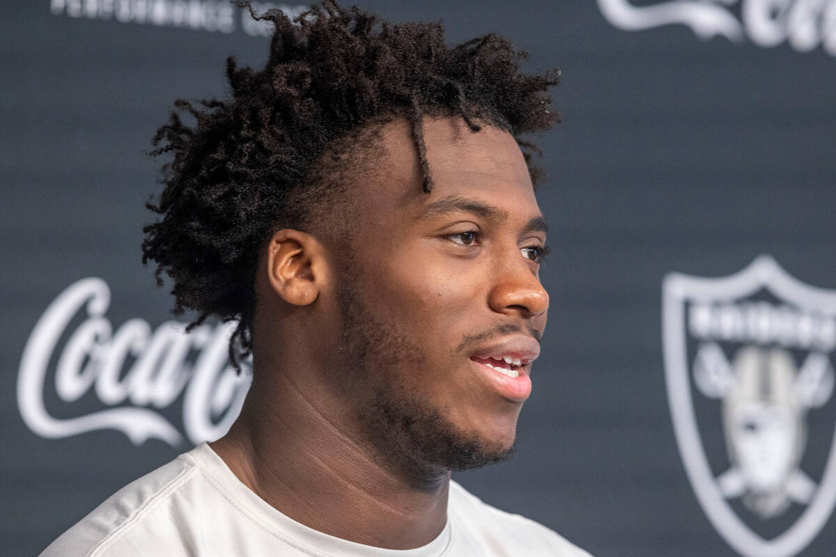 Raiders defensive end Malcolm Koonce answers questions during a news conference after training ...