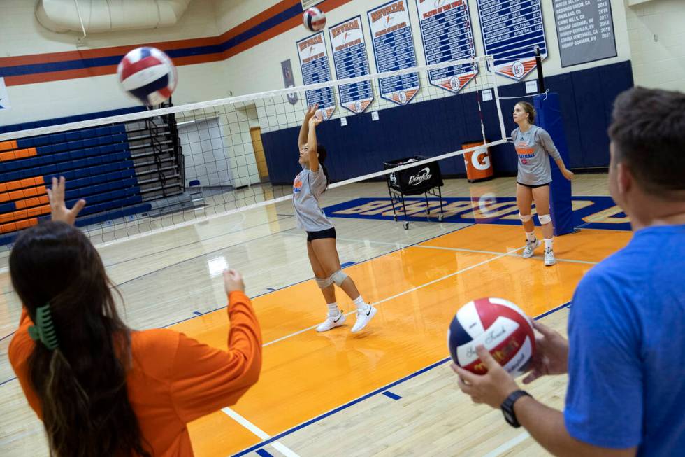 Bishop Gorman players practice setting during a girls high school volleyball practice at Bishop ...