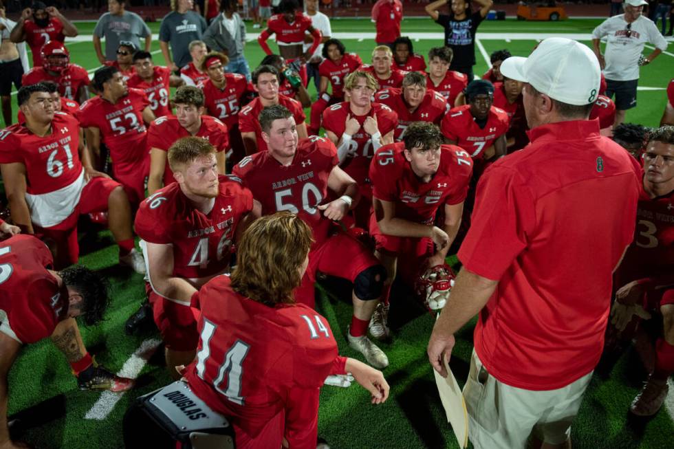 Arbor View High School huddles up after beating Snow Canyon 7-0 in the first game of the season ...