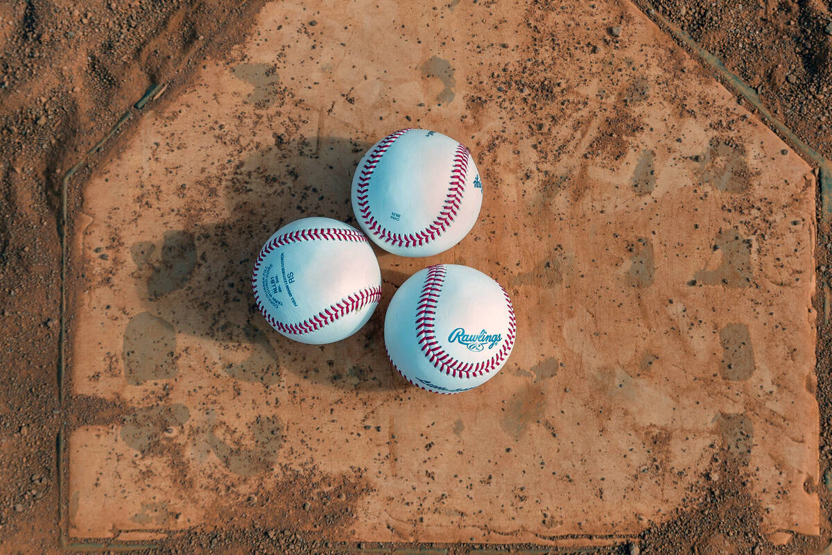 Baseballs are set on home plate as a game between the Brewers and Giants is due to start for a ...