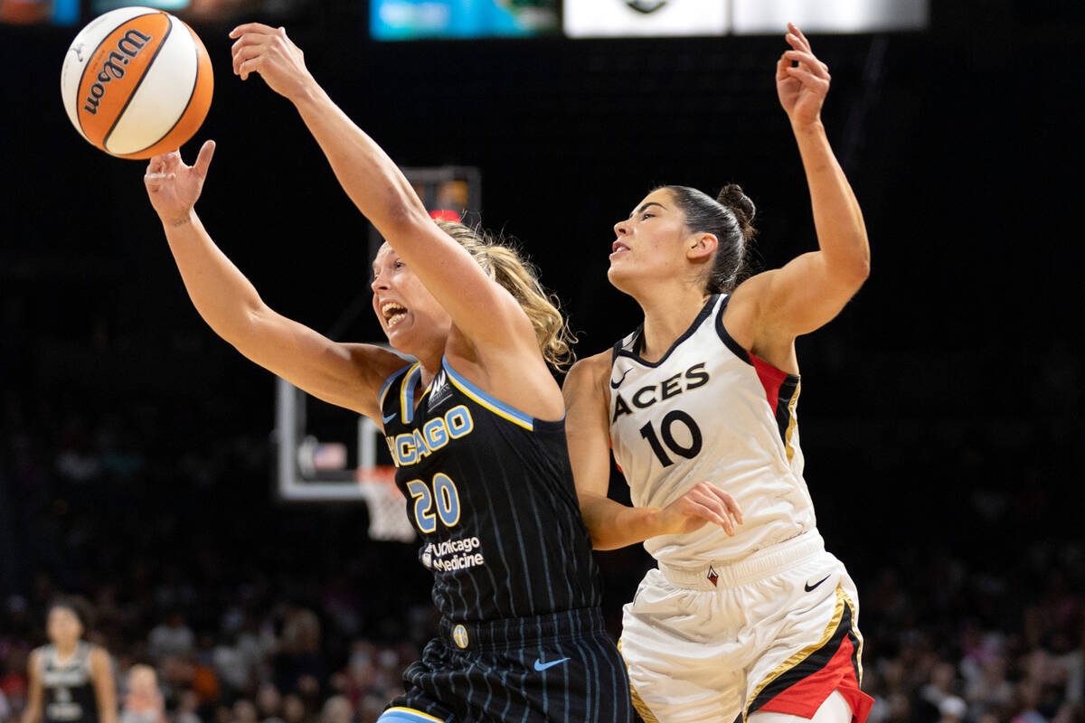 Chicago Sky guard Julie Allemand (20) and Las Vegas Aces guard Kelsey Plum (10) jump to catch a ...