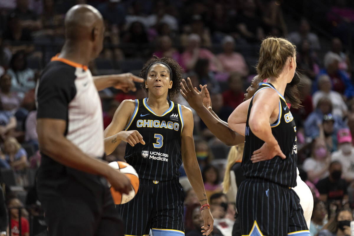 Las Vegas Aces guard Chelsea Gray (12) shouts at Chicago Sky forward Candace Parker (3) after r ...