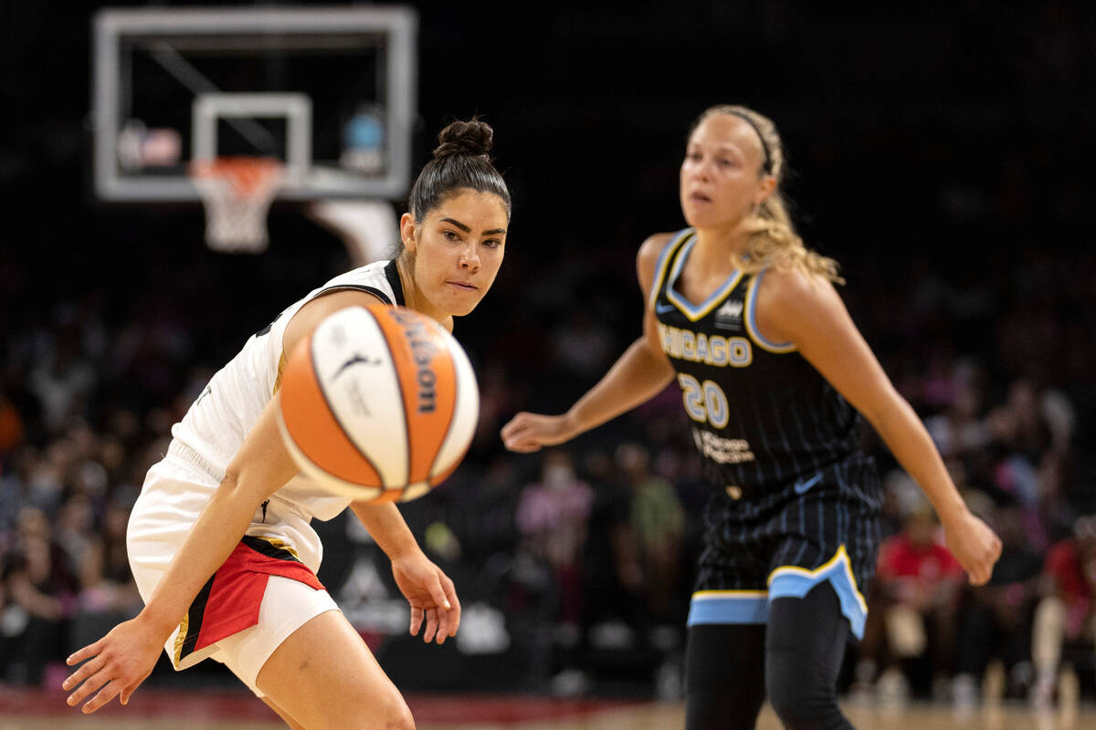 Las Vegas Aces guard Kelsey Plum (10) eyes a Chicago Sky pass while Chicago Sky guard Julie All ...