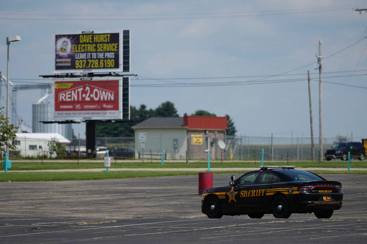 A Clinton County Sheriff's vehicle is parked in a lot in Wilmington, Ohio, during a standoff wi ...