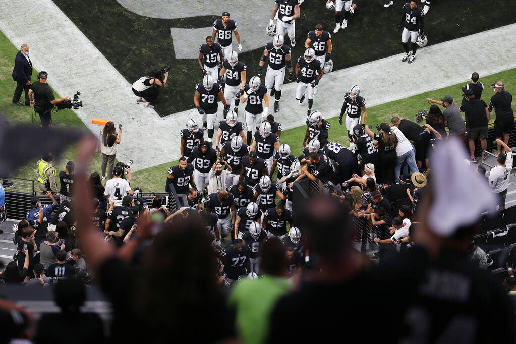 Las Vegas Raiders go to the locker room after warming up before the start of their NFL preseaso ...