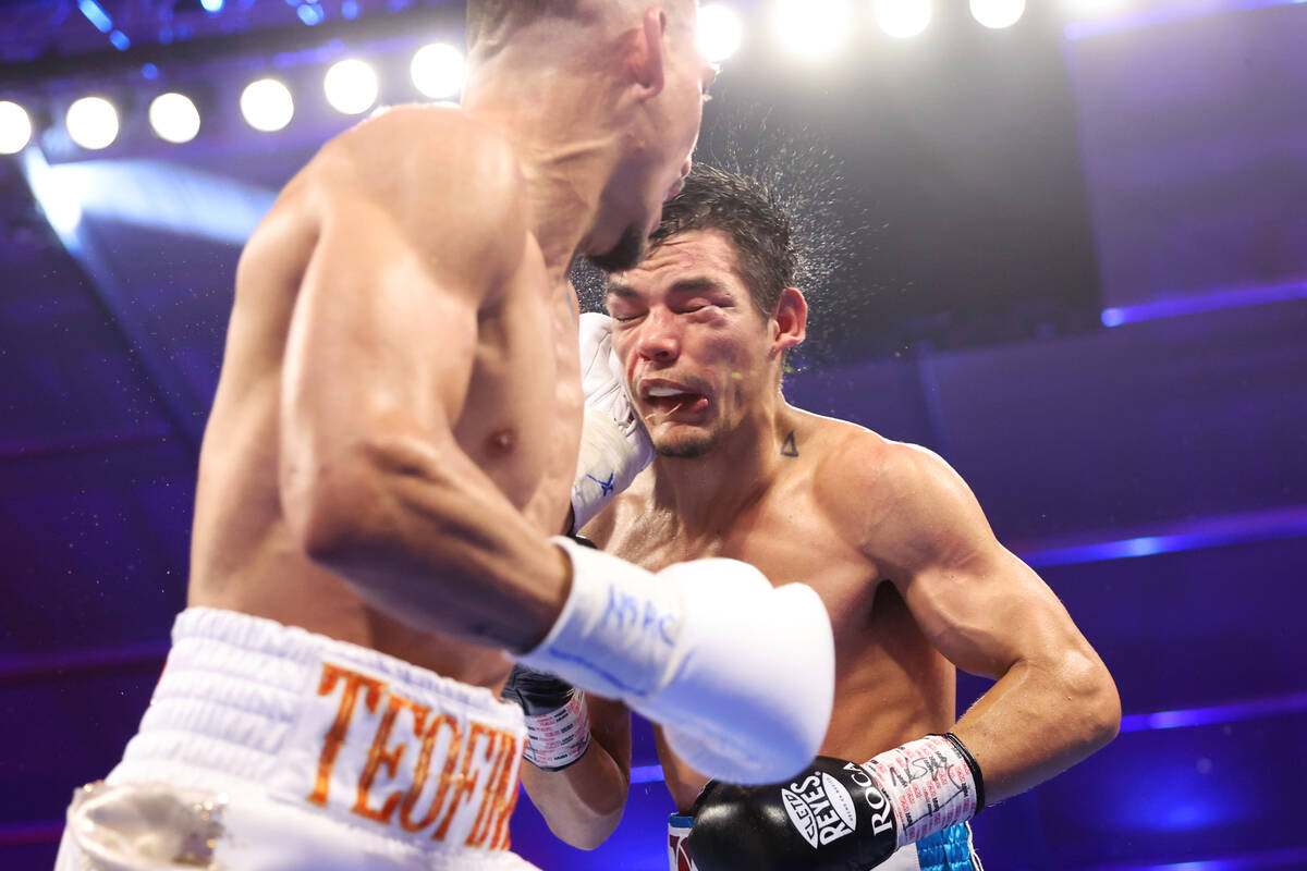 Teofino Lopez, right, connects a punch against Pedro Campa in the fifth round of a jr. welterwe ...