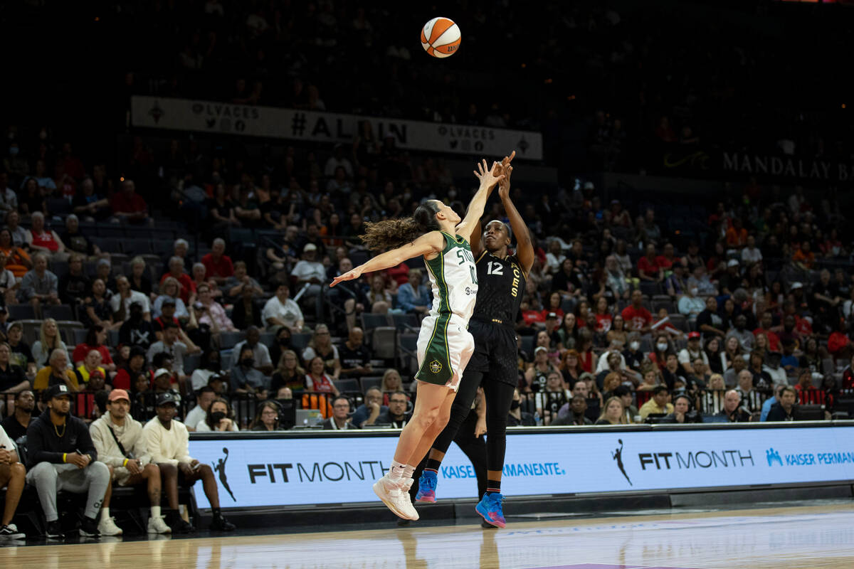 Aces guard Chelsea Gray (12) takes a shot over Seattle's Sue Bird (10) in the first half of the ...