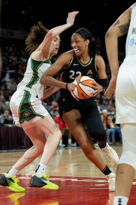 Aces forward A'ja Wilson (22) drives against Storm forward Breanna Stewart (30) as the Las Vega ...