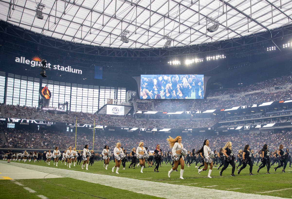 Raiderettes perform during halftime of a preseason NFL game to commemorate their 60-year annive ...