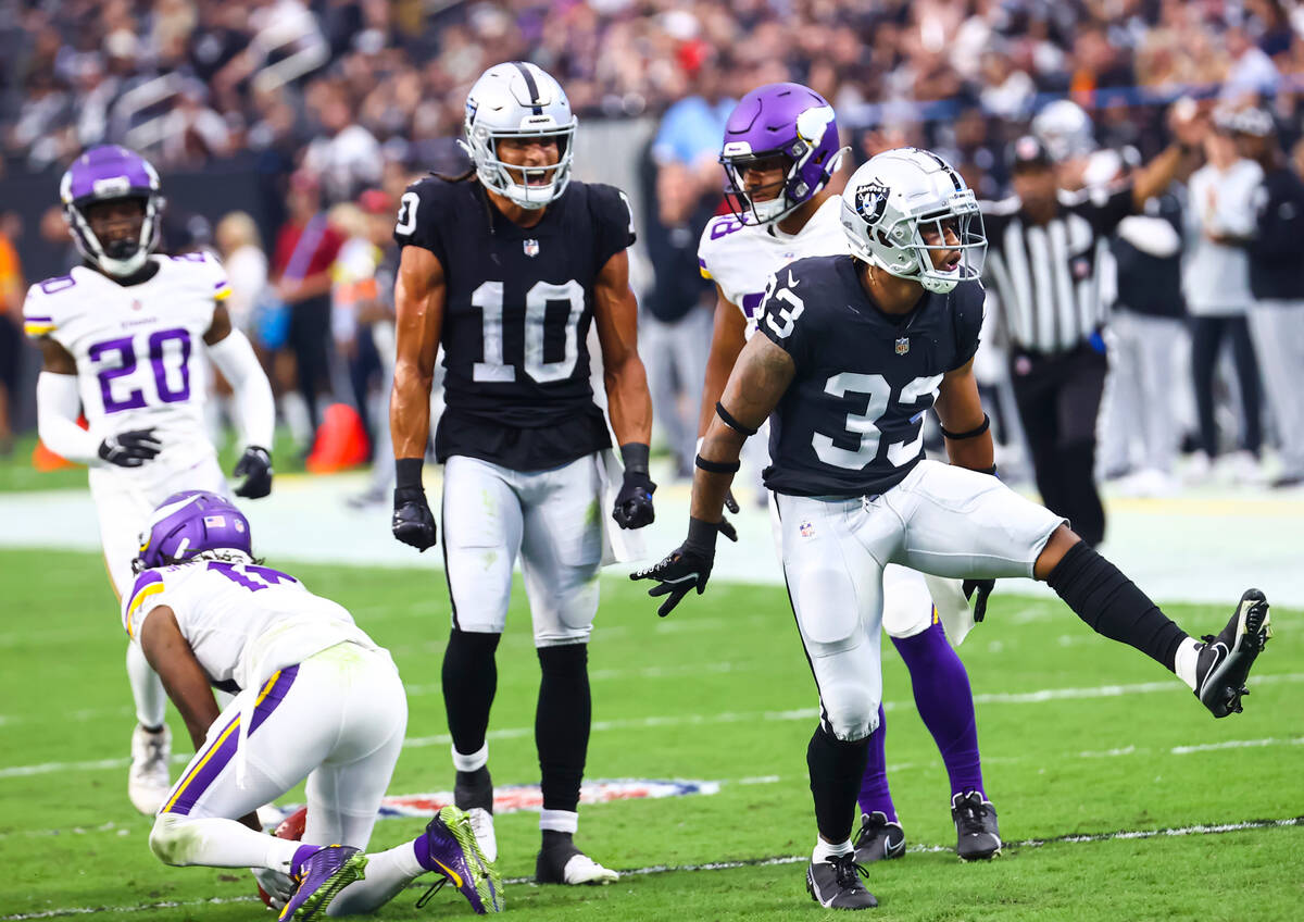 Raiders safety Roderic Teamer (33) reacts after tackling Minnesota Vikings wide receiver Ihmir ...