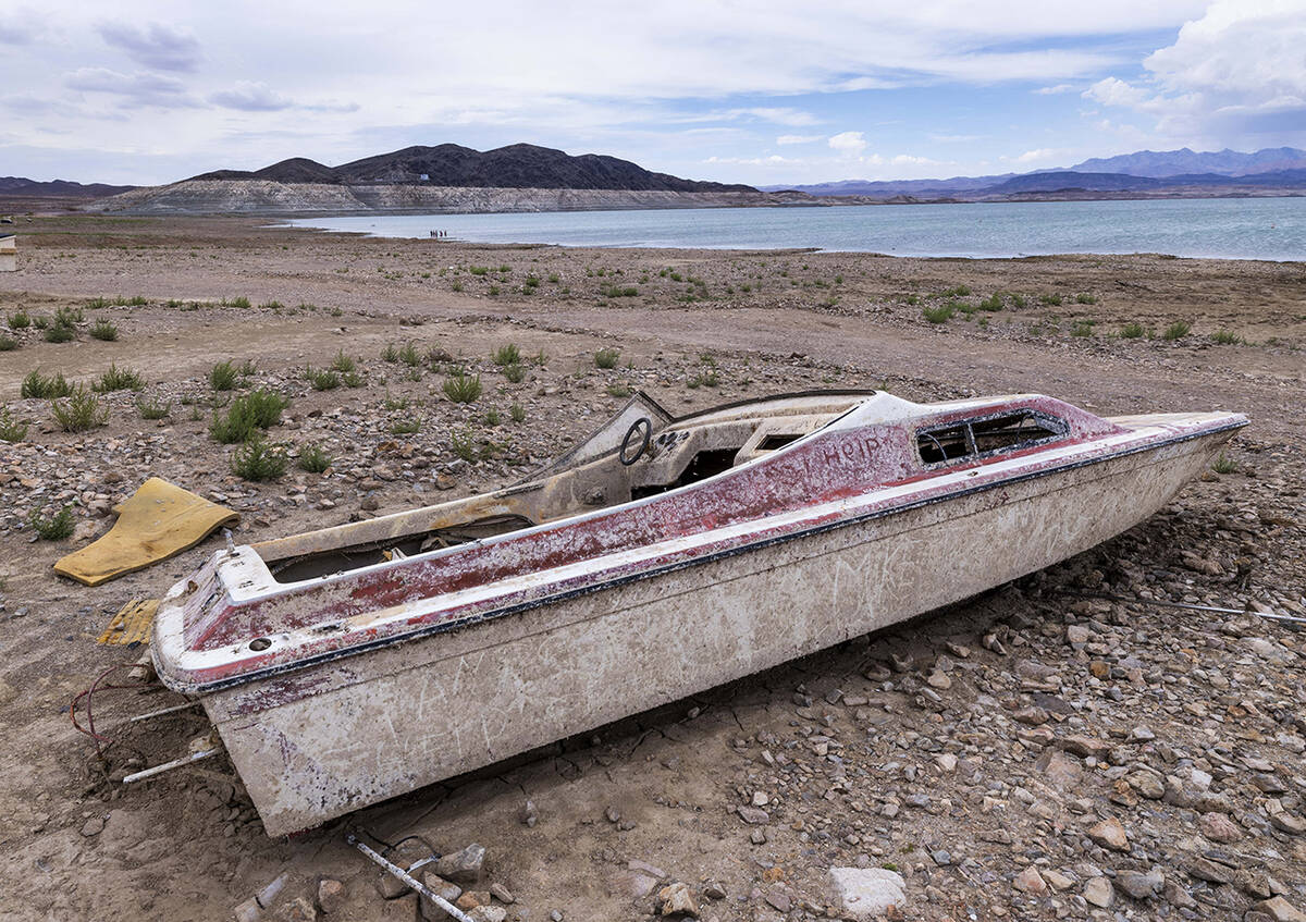 Another abandoned boat rests up above the waterline where a body was found at Swim Beach within ...