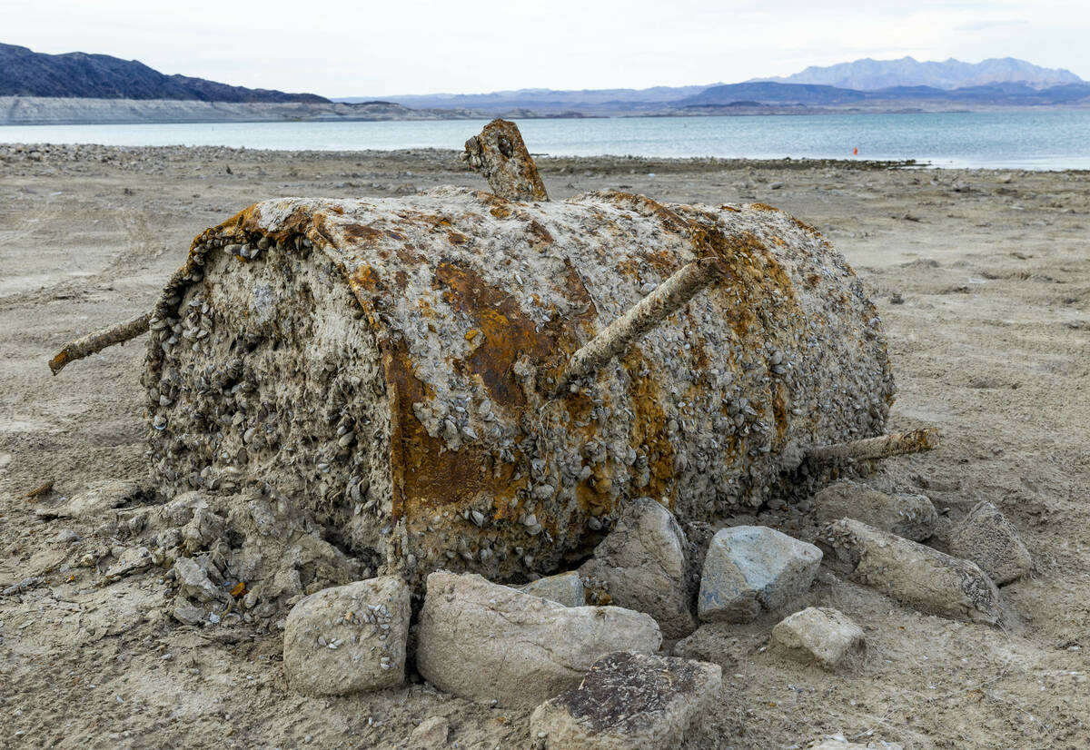 A large barrel decomposes along the shoreline near where a body was found at Swim Beach within ...