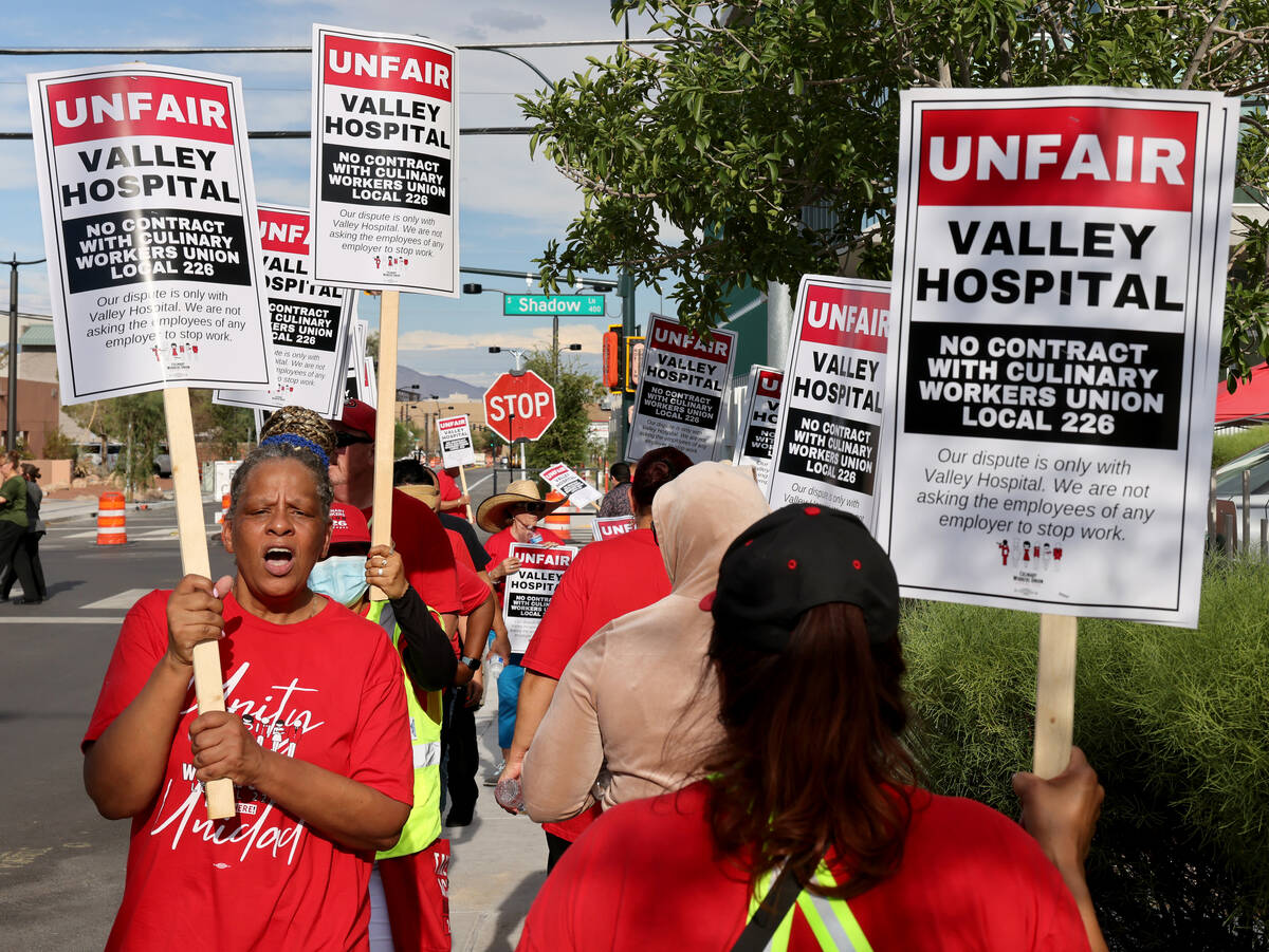 Members of the Culinary Union, including 40-year employee Betty Williams, left, and supporters ...