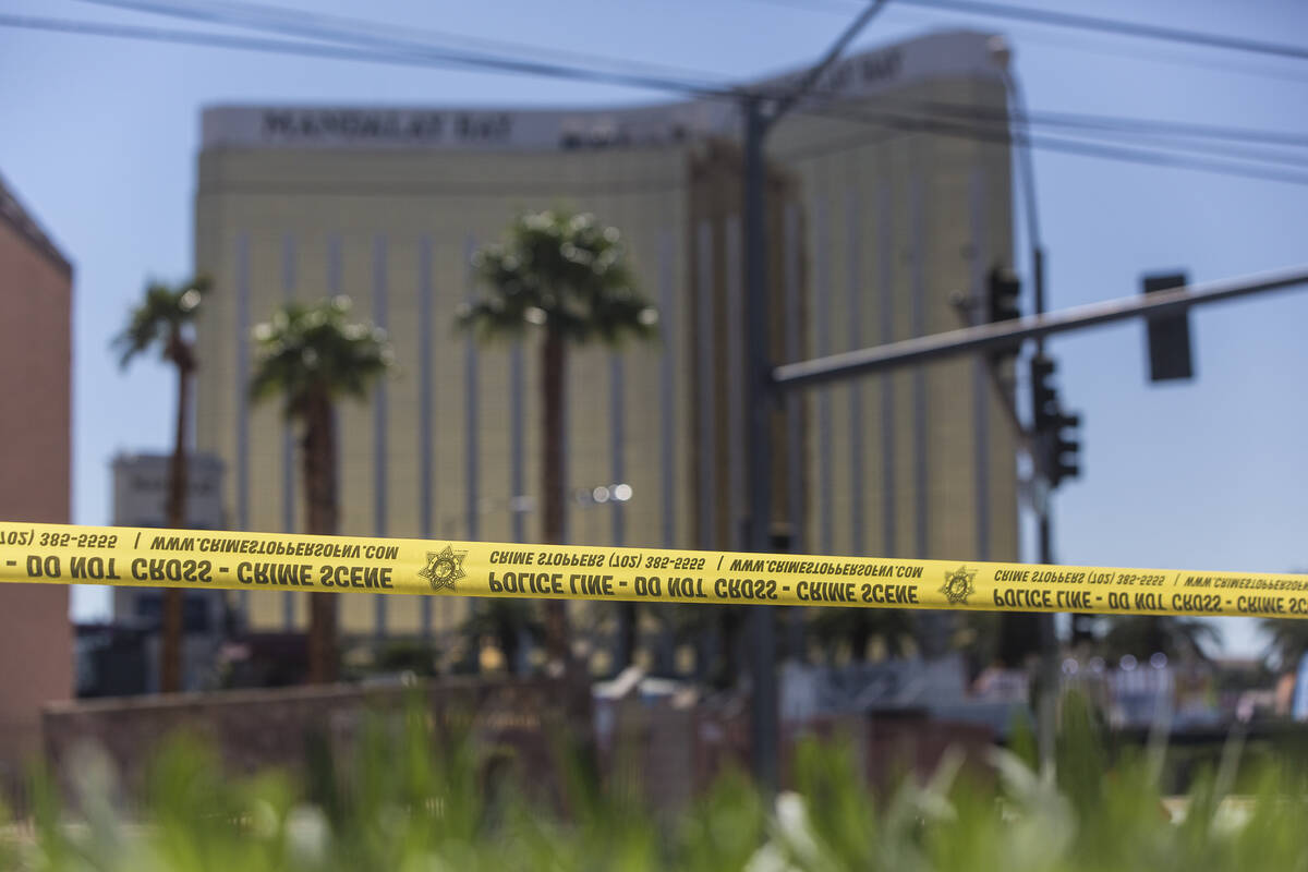 Police tape blocks a section of West Reno Avenue and Las Vegas Boulevard on Oct. 2, 2017, outsi ...